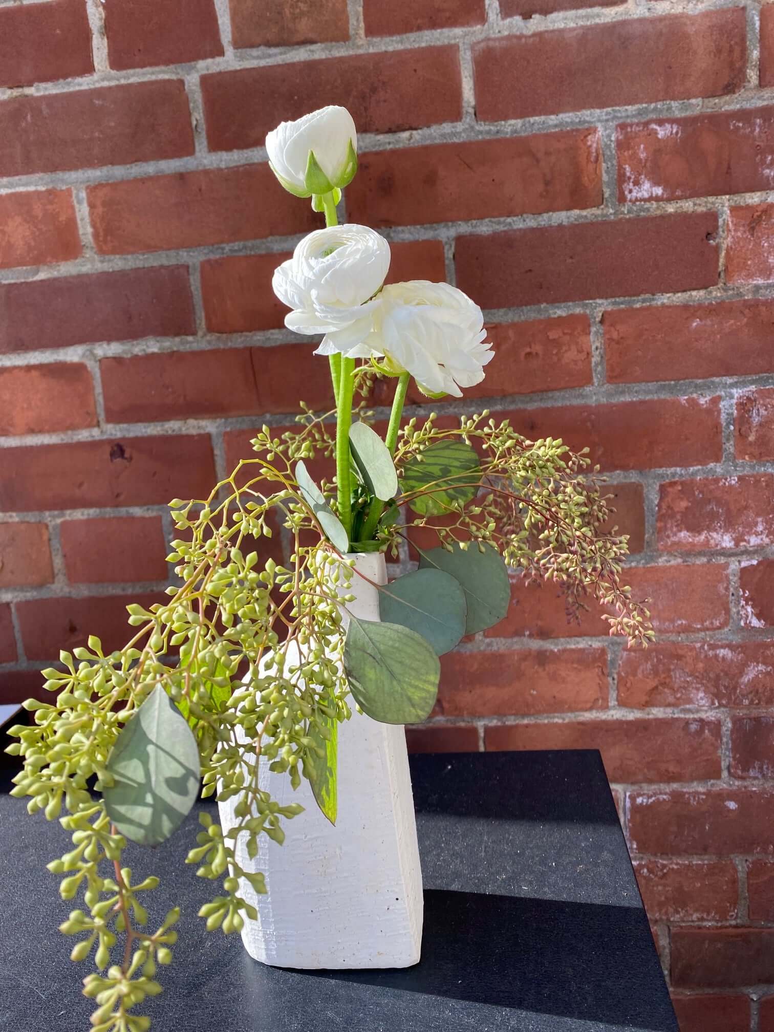 Ranunculus & Seeded Eucalyptus in White Rustic Bookend Budvase, by Lou-Lou's Flower Truck